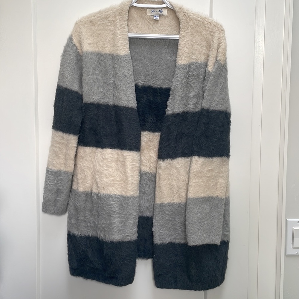 One size.  Warm cozy long sweater oversized